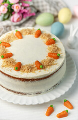 Wall Mural - Homemade Easter carrot cake made with walnuts, iced with cream cheese. Sweet dessert.