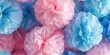 Colorful tissue pom poms in pink and blue. Perfect for adding a fun and festive touch to any celebration or event