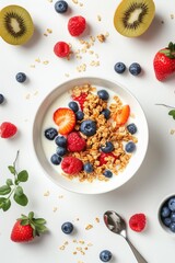 Wall Mural - A delicious bowl of granola topped with fresh berries and sliced kiwis. Perfect for a healthy breakfast or snack