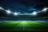 Fototapeta Sport - A picture of a soccer stadium with a vibrant green field and brightly lit lights. Perfect for sports enthusiasts or event promotions
