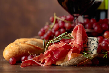 Wall Mural - Sandwich with prosciutto, blue cheese and rosemary.