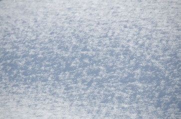 Wall Mural - rough grainy fresh white snow surface texture abstract background