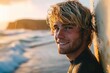 handsome young  blonde guy surfer in wetsuit  portrait on the beach at sunset or sunrise with his surfboard