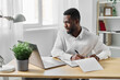 © SHOTPRIME STUDIO - office man student laptop cyberspace american job online computer african education freelancer