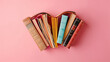 Beautiful Hardcover Books Arranged in Heart Shape, Symbolizing Love for Literature and Reading on Pink Background, Romantic or Affectionate Concept, Book Spines Outward, Creative and Colorful Arrangem