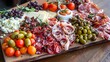 A vibrant antipasto platter featuring cured meats, olives, cheeses, and marinated vegetables