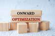 Onward optimization text on wooden blocks. Operational excellence concept