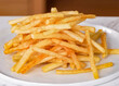 French Fries Crinkle Cut, cutout minimal isolated on plate, white background. Homemade french fries for sale, package, advert, close up, selective focus