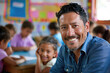 © Kitta - Portrait of smiling male teacher in a class at elementary school looking at camera