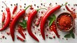 Fresh red chili peppers, vibrant spices, green leaves, peppercorns scattered artistically on a white background