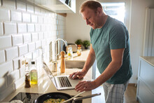 Man preparing meal in the home kitchen