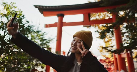 Poster - Selfie, nature and Japanese woman with peace sign for holiday, vacation and adventure in Japan. Happy, travel and person take picture on smartphone for social media post, memories and online blog