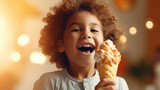 Fototapeta Uliczki - Latin American child portrait enjoying caramel ice cream cone, copy space