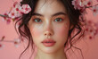 beautiful asian woman with cherry blossom flowers and freckled makeup