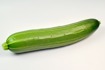 cucumber with a green color and a long shape and a fresh overlay on the peel