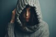 Woman Hiding Face. Portrait of Depressed European Adult Female Pulling Sweater Over Her Head,