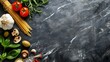 Italian food background, with vine tomatoes, basil, spaghetti, mushrooms, olives, parmesan, olive oil, garlic, peppercorns, rosemary, parsley and thyme. Slate background.