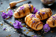 Eclairs drizzled with honey and garnished with candied violets. Generative AI