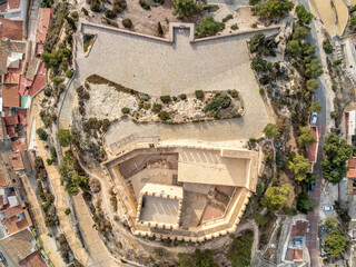 Wall Mural - Aerial view of Petrer, medieval town and hilltop castle with restored tower and battlements near Elda Spain,