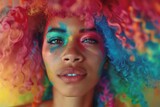 Fototapeta Tęcza - Creative portrait of a woman with a colorful afro and curly hair Set against an abstract and artistic background Celebrating diversity and individuality.