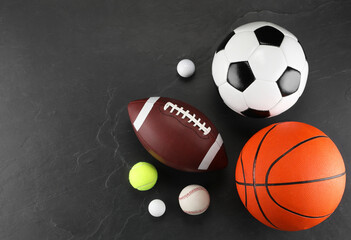 Poster - Many different sports balls on dark gray background, flat lay. Space for text