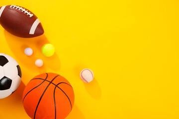 Poster - Many different sports balls on yellow background, flat lay. Space for text