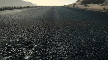 Desolate Desert Road Under A Clear Sky, Evoking A Sense Of Solitude And Journey.