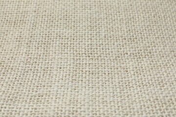 Texture of beige fabric as background, closeup