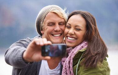 Poster - Selfie, phone screen and couple hug in nature for travel, freedom or road trip adventure together. Smartphone, photography and people with love outdoor for camping, journey or social media memory