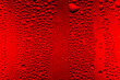 Leinwandbild Motiv Red close-up macro drink water drop surface,Water droplets on a glass of red cold drink for background and texture. (close up, selective focus, space for text)