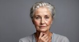 beautiful eldery woman portrait silver blouse gray