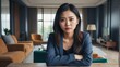 © Arceli - Portrait of a beautiful young worried asian woman on a table in the living room background from Generative AI