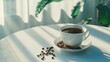 Hot black coffee and coffee beans on a white table with soft focus. Top view. With space for your text