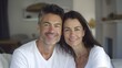 © Irina Ukrainets - Happy couple smiling together in a cozy home setting. casual and natural style, lifestyle portrait, authentic emotions captured. AI