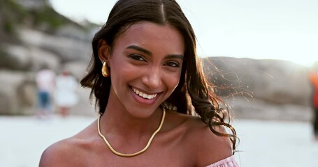 Poster - Woman, face and relaxing on beach, happy and smiling in outdoors or travel to ocean for fun. Indian female person, portrait and satisfaction or free in nature, peace and calm on holiday or getaway