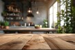 Copy space on wooden tabletop for montage over blurred modern apartment kitchen space