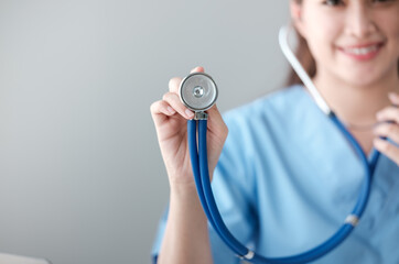 Portrait of asian young f nurse using stethoscope in hospital. Concept Of Medical Technology and Healthcare Business.