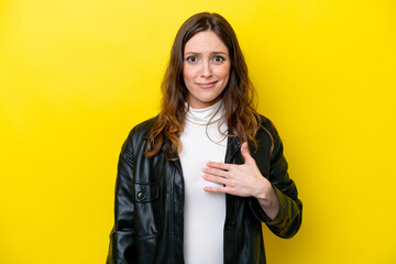 Wall Mural - Young caucasian woman isolated on yellow background pointing to oneself