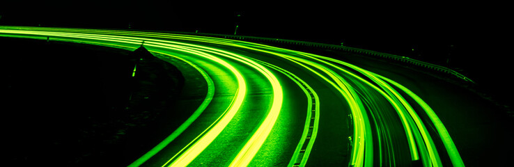 green car lights at night. long exposure