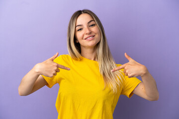 Wall Mural - Young woman over isolated purple background proud and self-satisfied