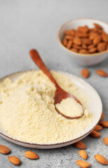 Wall Mural - Fresh almond flour in a  bowl and almonds