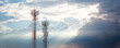 © kanpisut - Communication tower top. Radio antenna Tower , microwave antenna tower on light sky background. wireless technology concept. communication development concept.