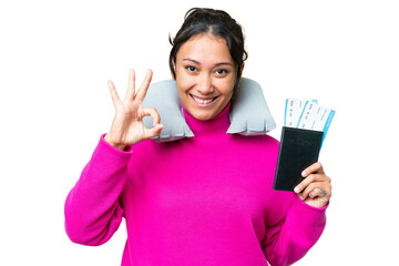Wall Mural - Young Uruguayan woman holding a passport over isolated chroma key background showing ok sign with fingers