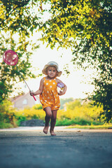 Wall Mural - A child catches a butterfly in nature. selective focus.