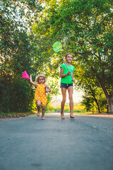 Wall Mural - A child catches a butterfly in nature. selective focus.