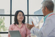 © Chadaporn - The doctor is giving advice and recommending health care methods to the patient in a friendly way, The doctor and the patient are discussing the process of future treatment.