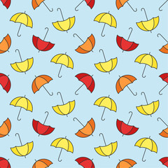 Wall Mural - Bright yellow, orange and red umbrellas on blue background. Vector seamless pattern.