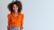 Afro woman wear orange shirt smiling laugh out loud isolated on grey