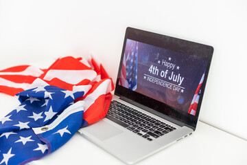 Wall Mural - laptop with inscription 4 July inscription over american flag. Independence day.