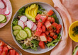 Fresh salad with vegetables, avocado, rise in bowl. Homemade delicious lunch buddha bowl salad with tomato for restaurant, menu, advert or package, close up selective focus